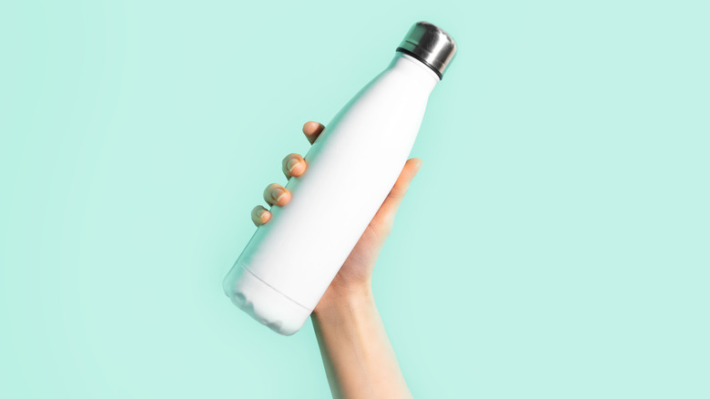 Reusable water bottle with lid