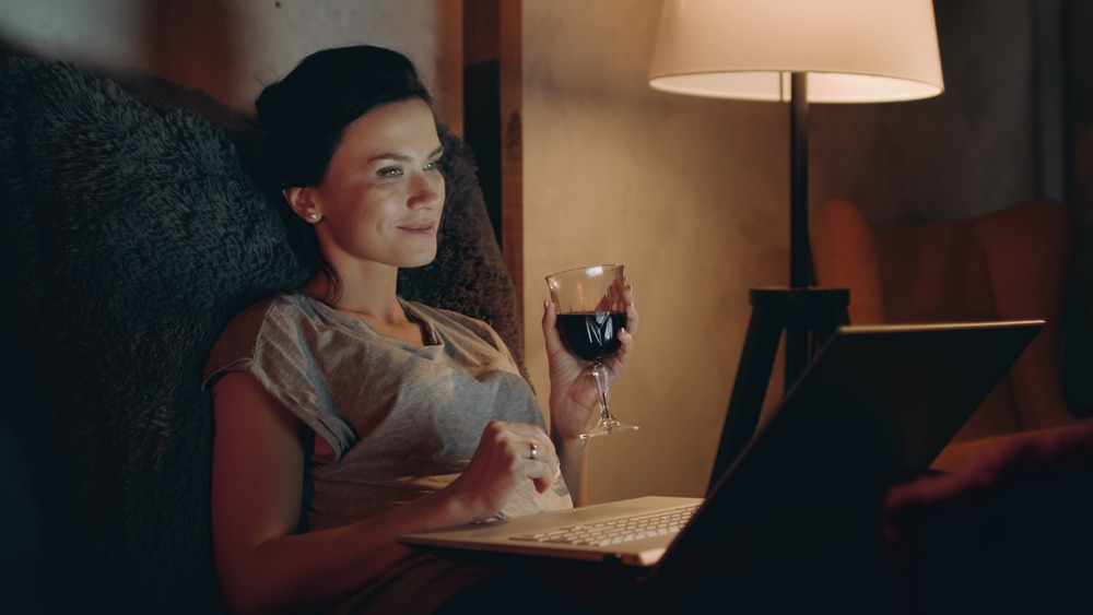 Woman enjoying wine alone