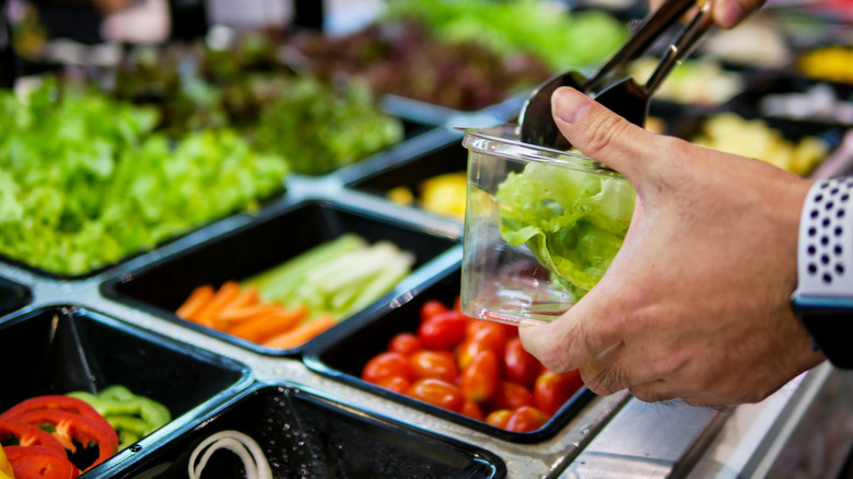 Person served at salad bar