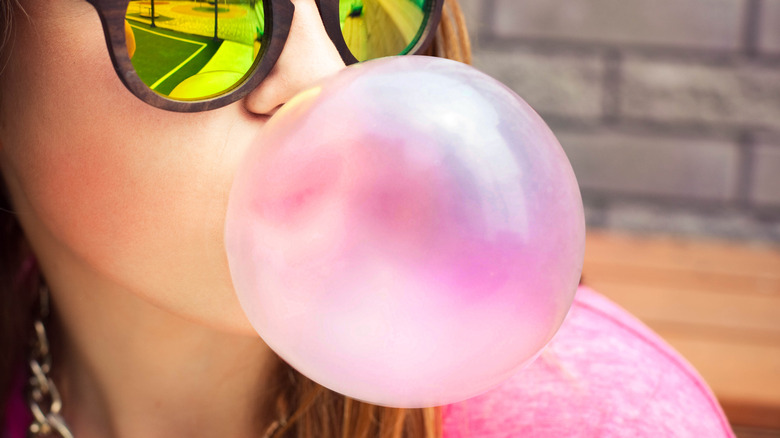 blowing bubble with gum
