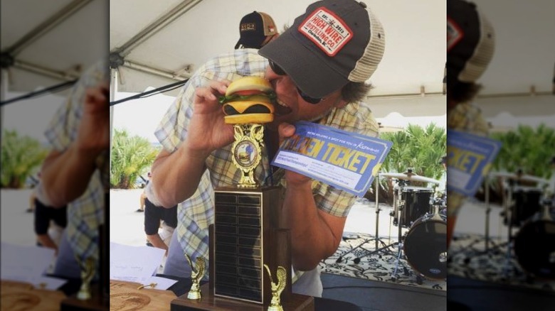 George Motz with burger trophy