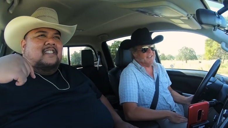 George Motz and Alvin Cailan driving