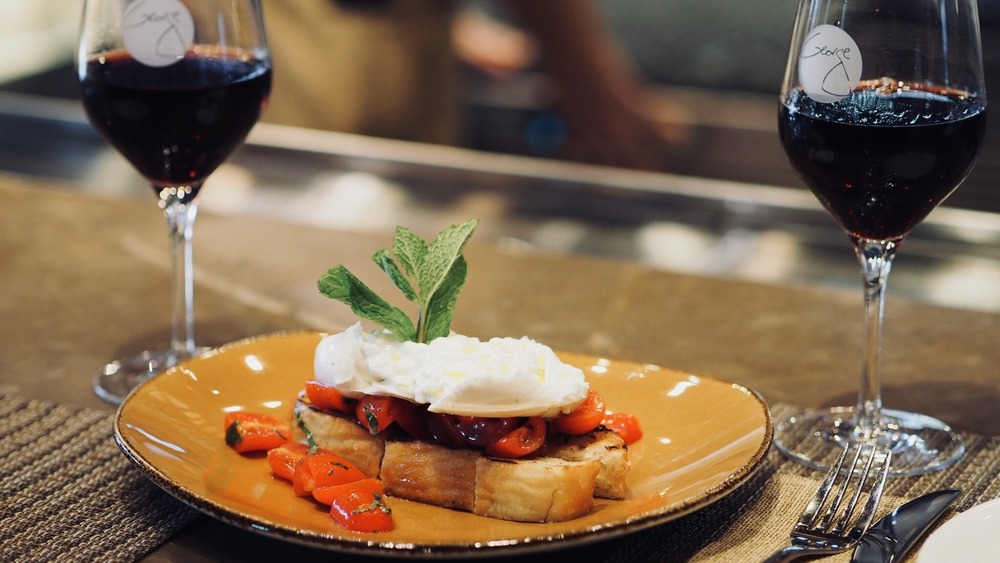 burrata toast appetizer with wine