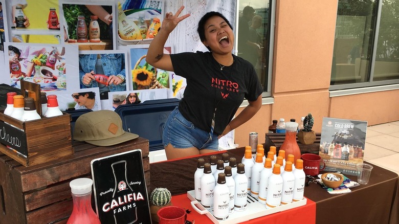 Young girl selling Califia Farms products