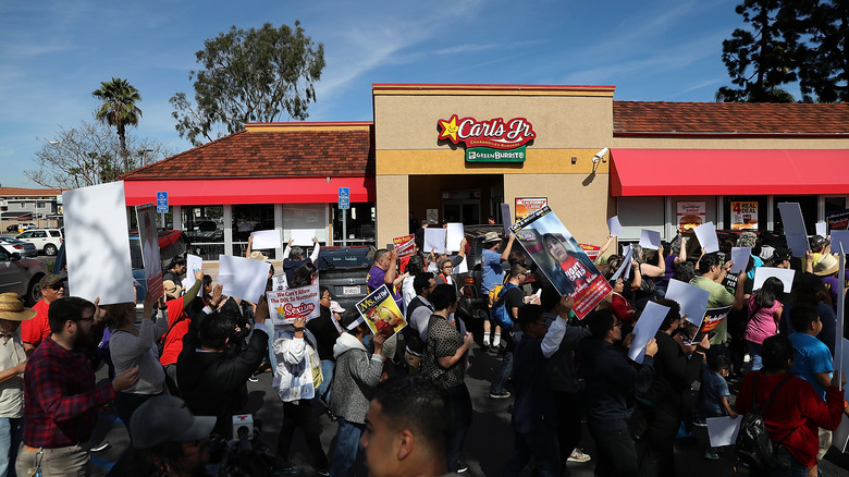 Protestors outside of a Carl's Jr.