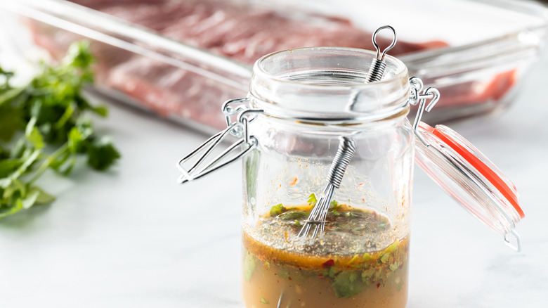 a jar of marinade ready for steak