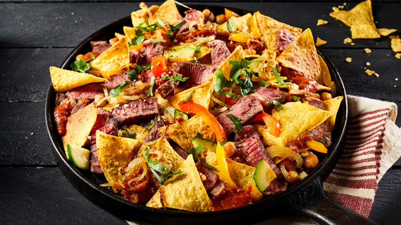 Nachos topped with carne asada