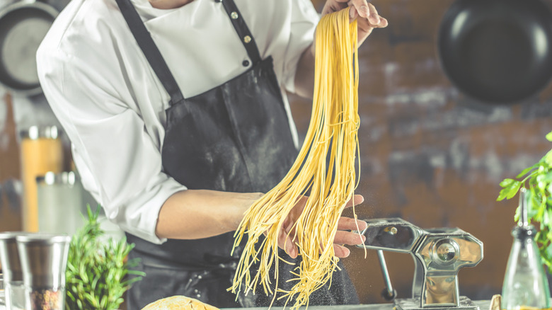 Man making fresh spaghetti