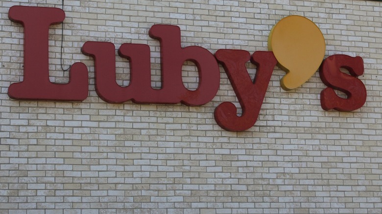 luby's logo on brick wall