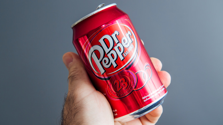 Dr pepper held in a hand