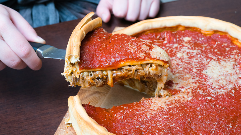 stuffed pizza slice removed from pan