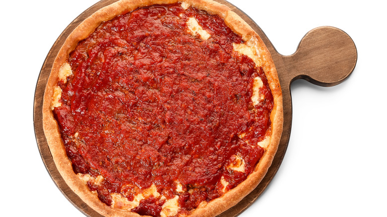 chicago deep-dish pizza from above on wooden board