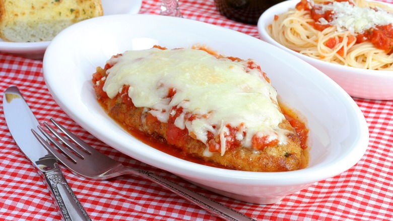 chicken parm on red tablecloth