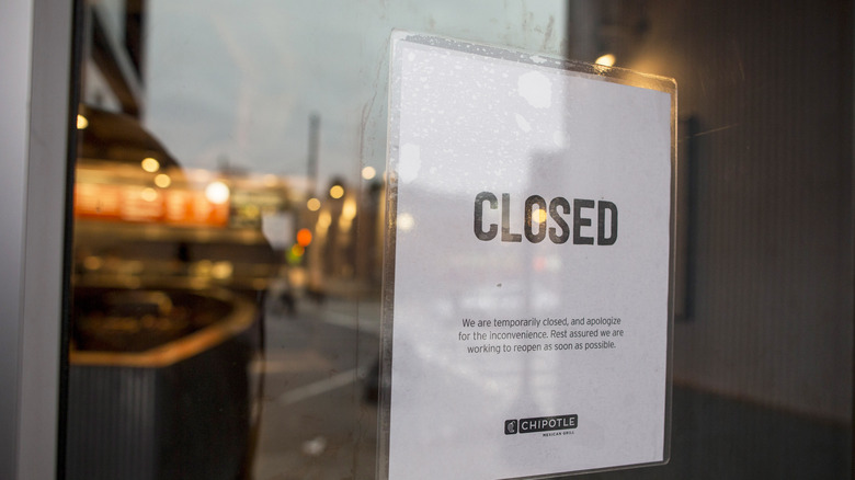 Closed sign outside Chipotle 