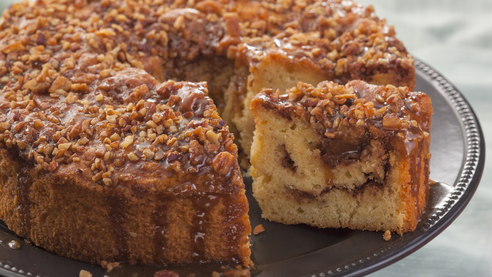 Drizzled coffee cake with slice taken out