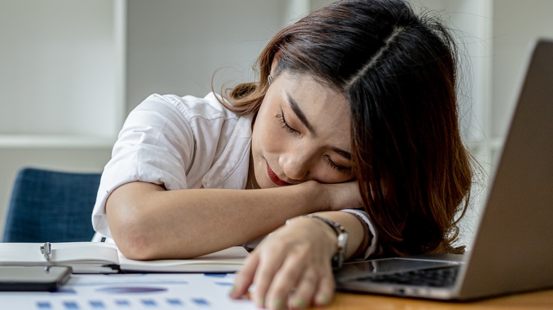 Woman asleep at her desk