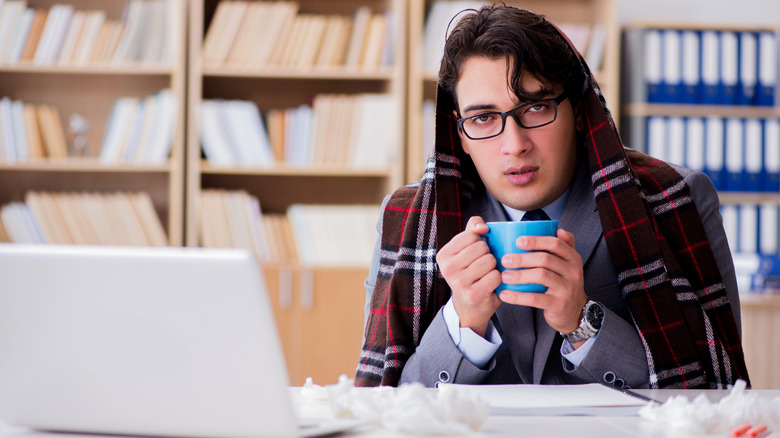 sick man with coffee