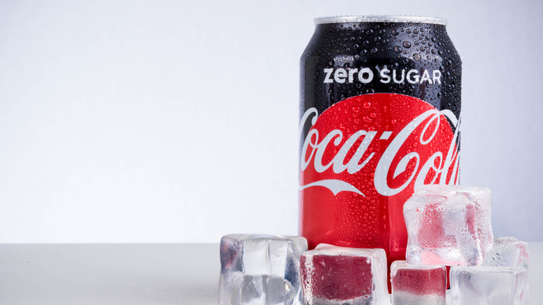 Can of Coke Zero Sugar surrounded by ice cubes