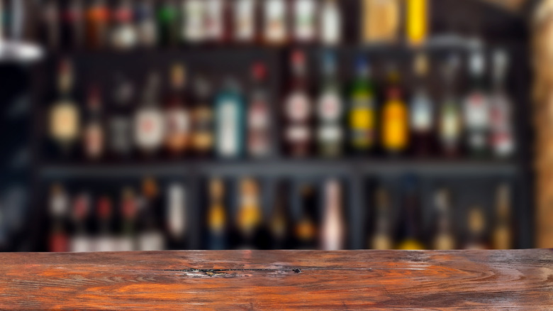 wine on shelf behind bar