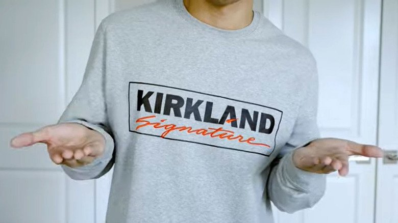 man wearing kirkland signature sweatshirts