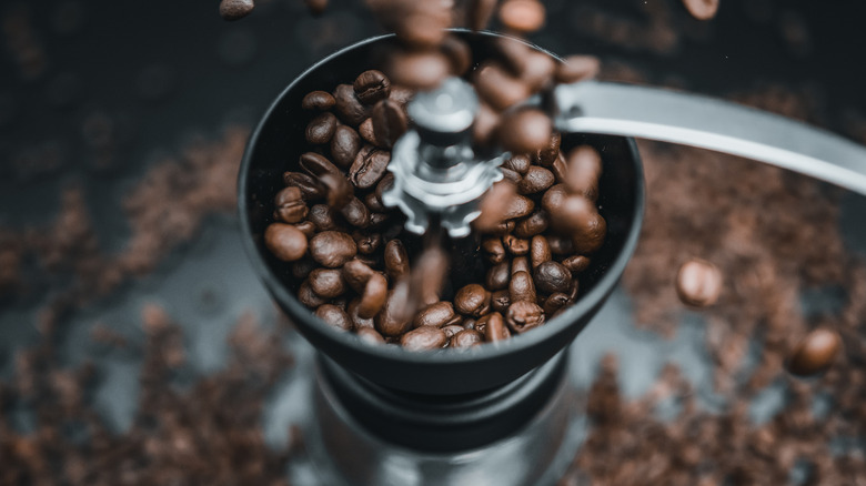 Coffee beans in grinder