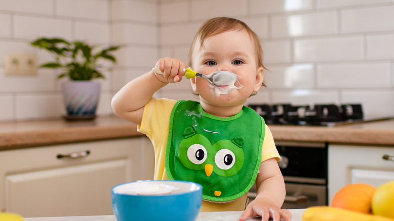 baby eating porridge