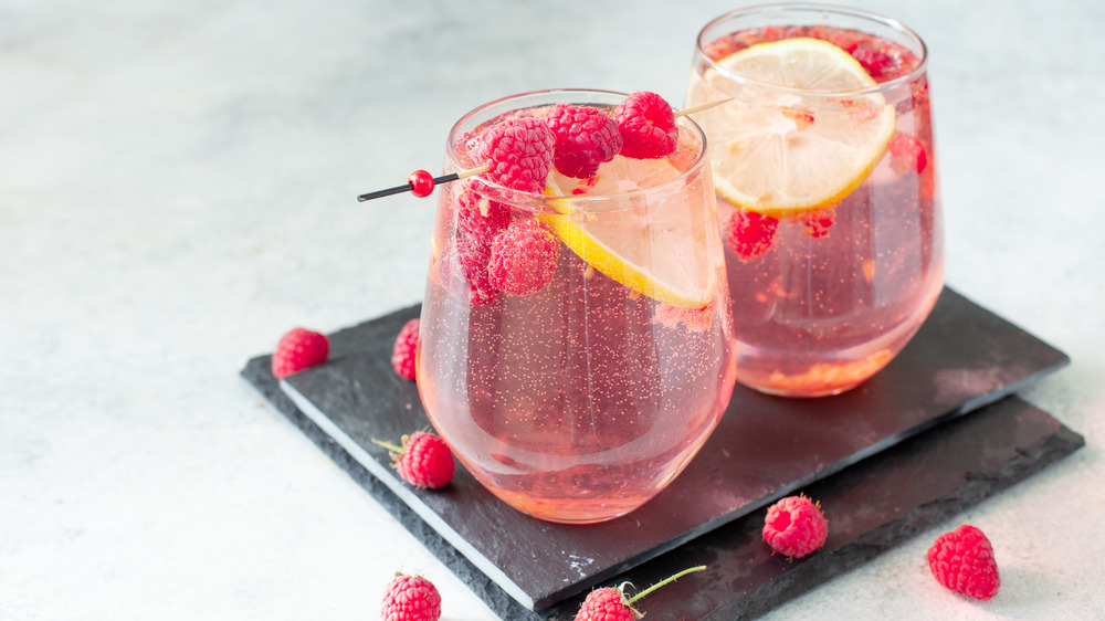 pink drink with lemon slices and raspberries