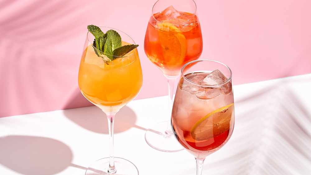 cocktails with fruit and mint garnishes