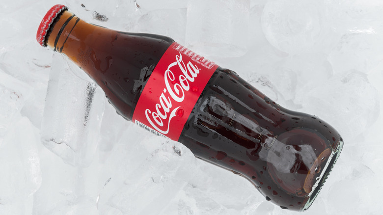 Glass coke bottle on ice