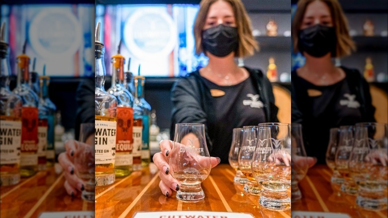 Cutwater employee serves tasting glass