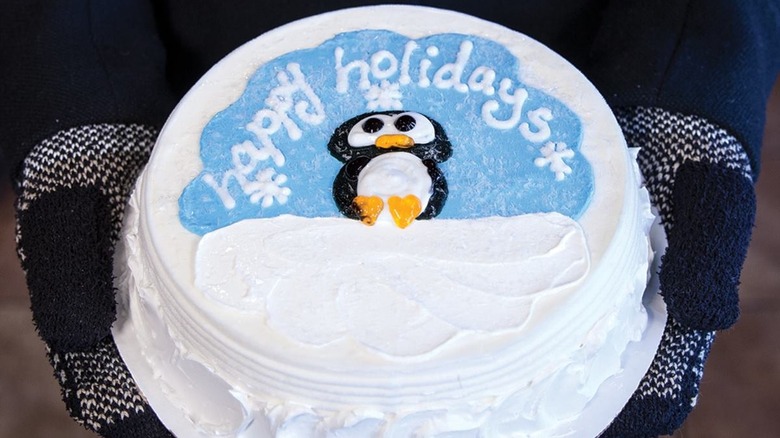 "Happy holidays" penguin cake