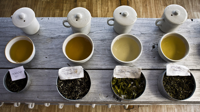 tea leaves tea pot green silver tips