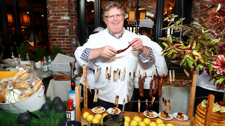 David Burke with bacon on a clothesline