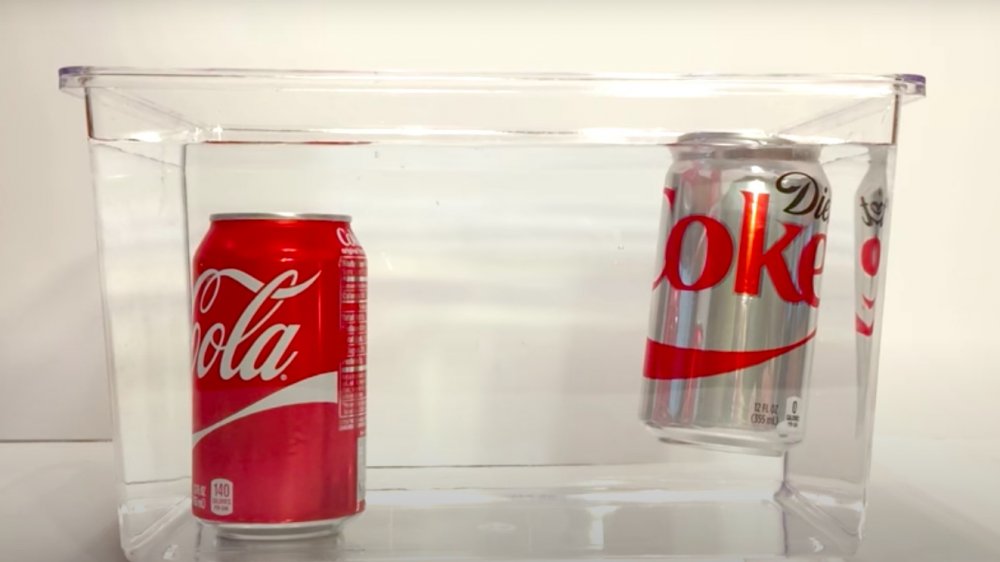 reason why diet coke floats in water