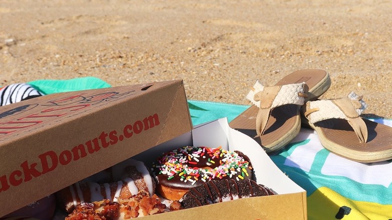 Duck donuts box on the beach