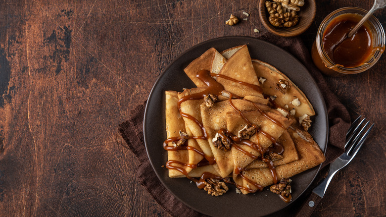 Caramel walnut crepes on a plate