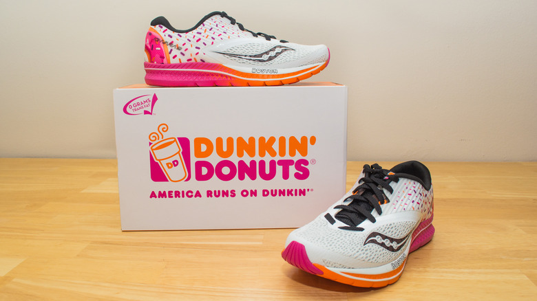 Pair of Saucony Dunkin' sneakers displayed