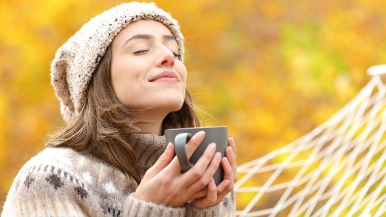 Woman enjoying seasonal coffee 