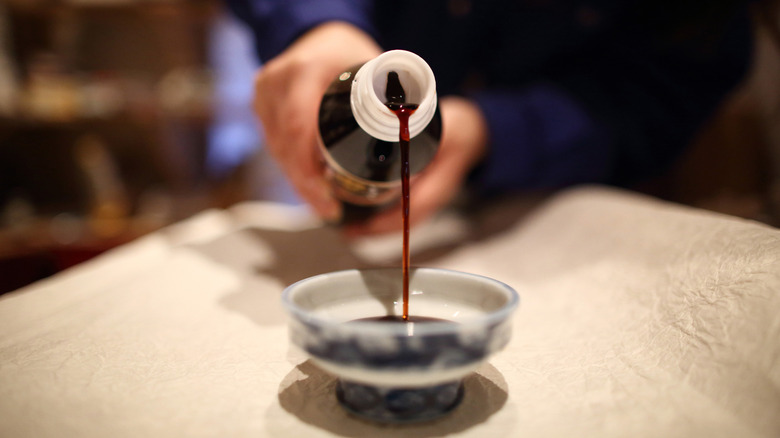 Soy sauce being poured 