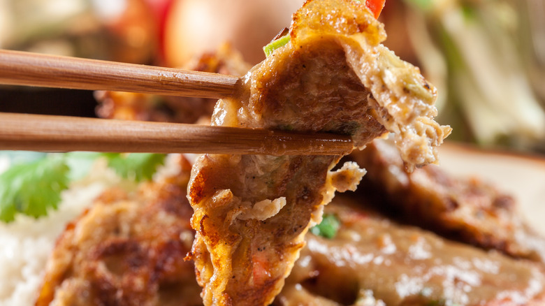 egg foo young with chopsticks