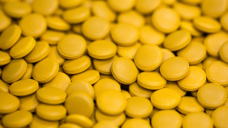 Orange pills in a pile