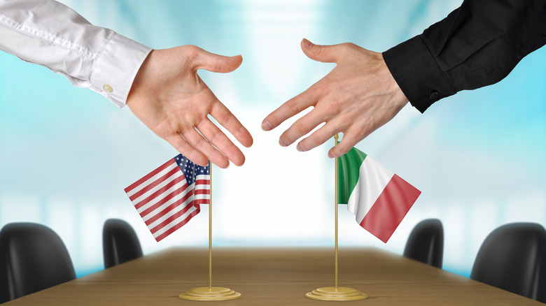 Italian ambassador shakes hands