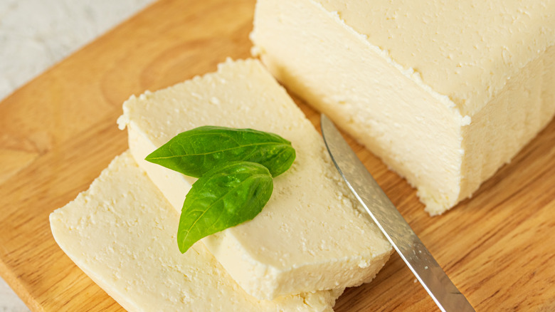 Sliced feta on cutting board