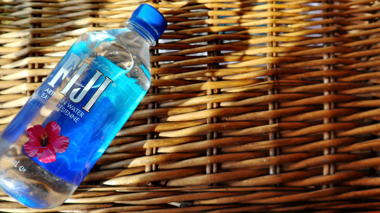 fiji water bottle wicker background