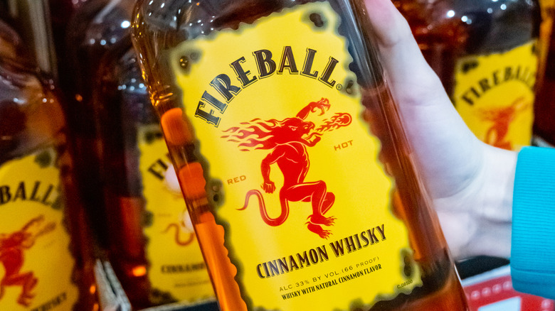 Someone holding a Fireball bottle