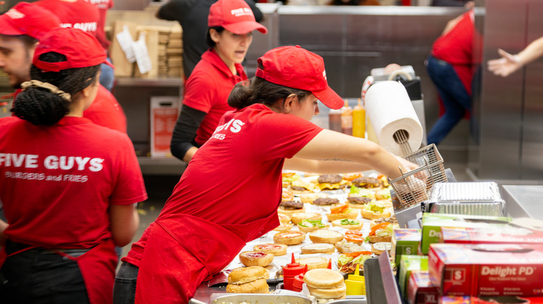 Five Guys employees in red shirts