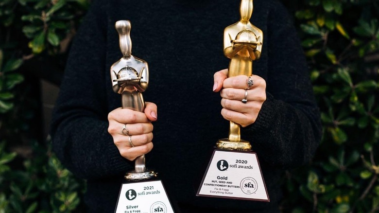 woman holding Fix & Fogg sofi awards
