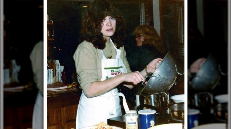 A teenage Valerie Bertinelli cooking in a kitchen