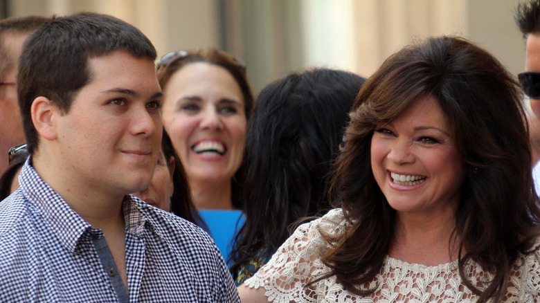 Valerie Bertinelli standing and smiling next to her son Wolfgang Van Halen