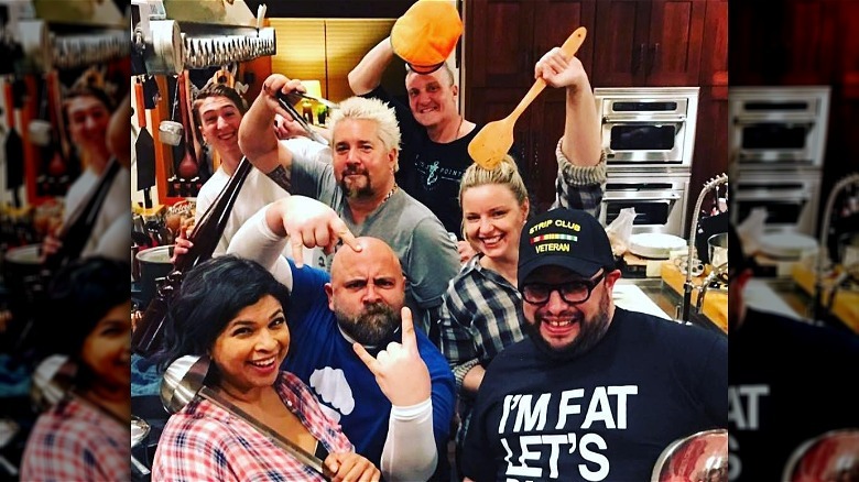 carl ruiz with restaurant crew